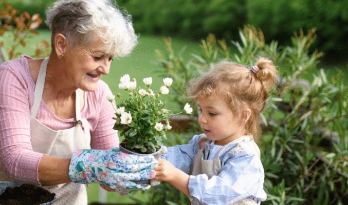 Grandmother & granddaughter gardening