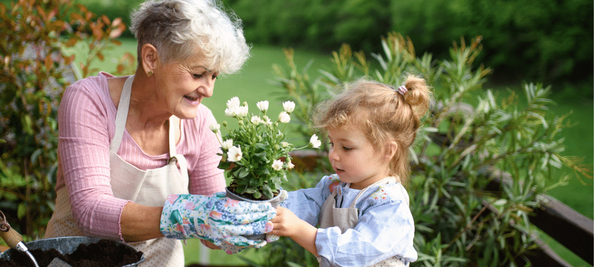 Grandmother & granddaughter gardening