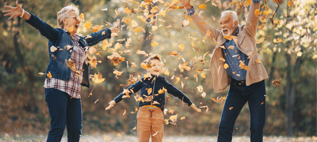 Seniors playing in the Autumn leaves