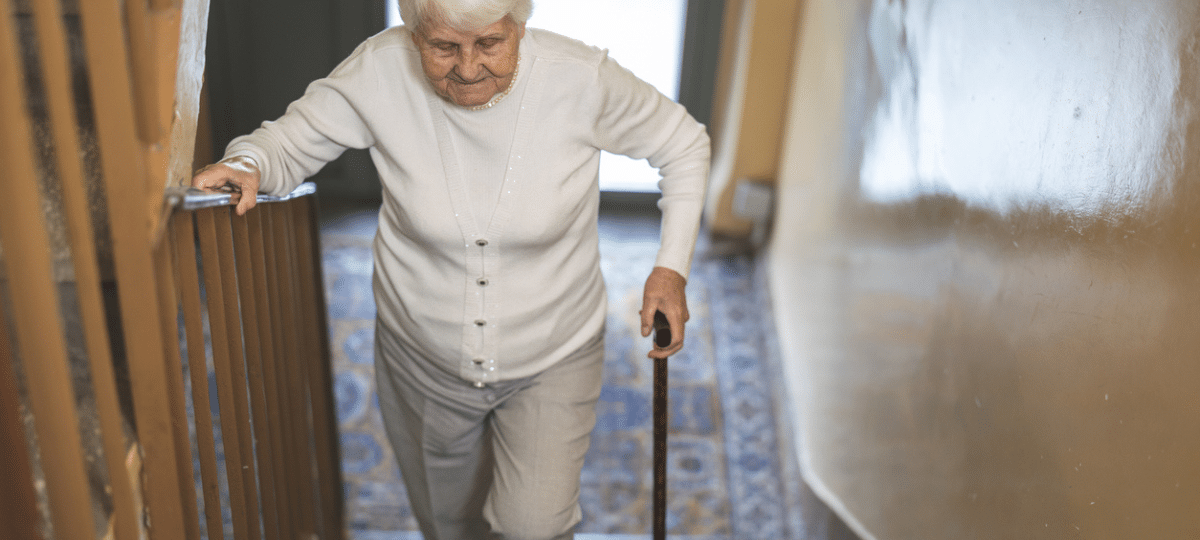 Senior woman walking up stairs