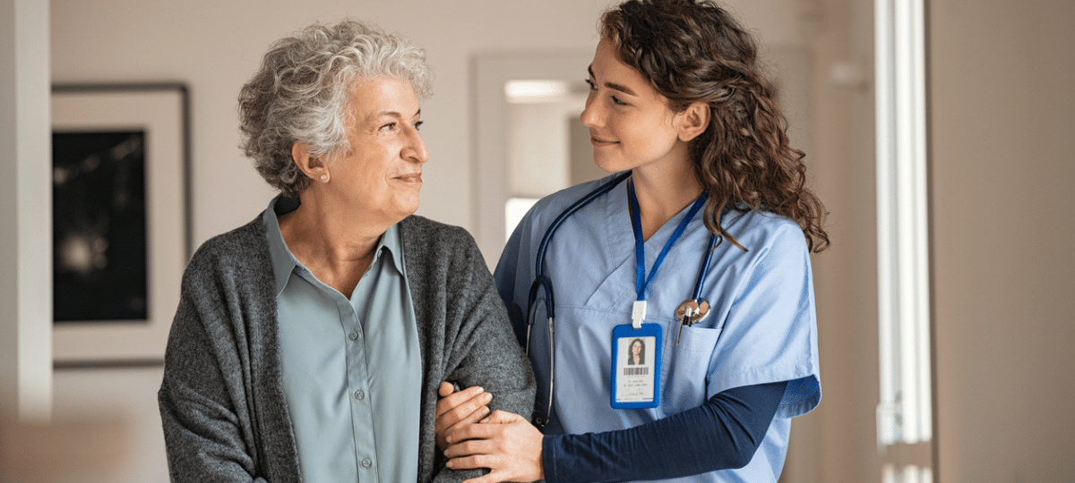 Senior walking w nurse