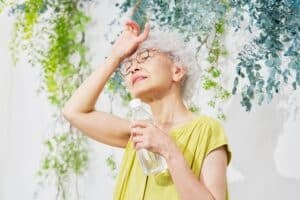 senior woman drinking water