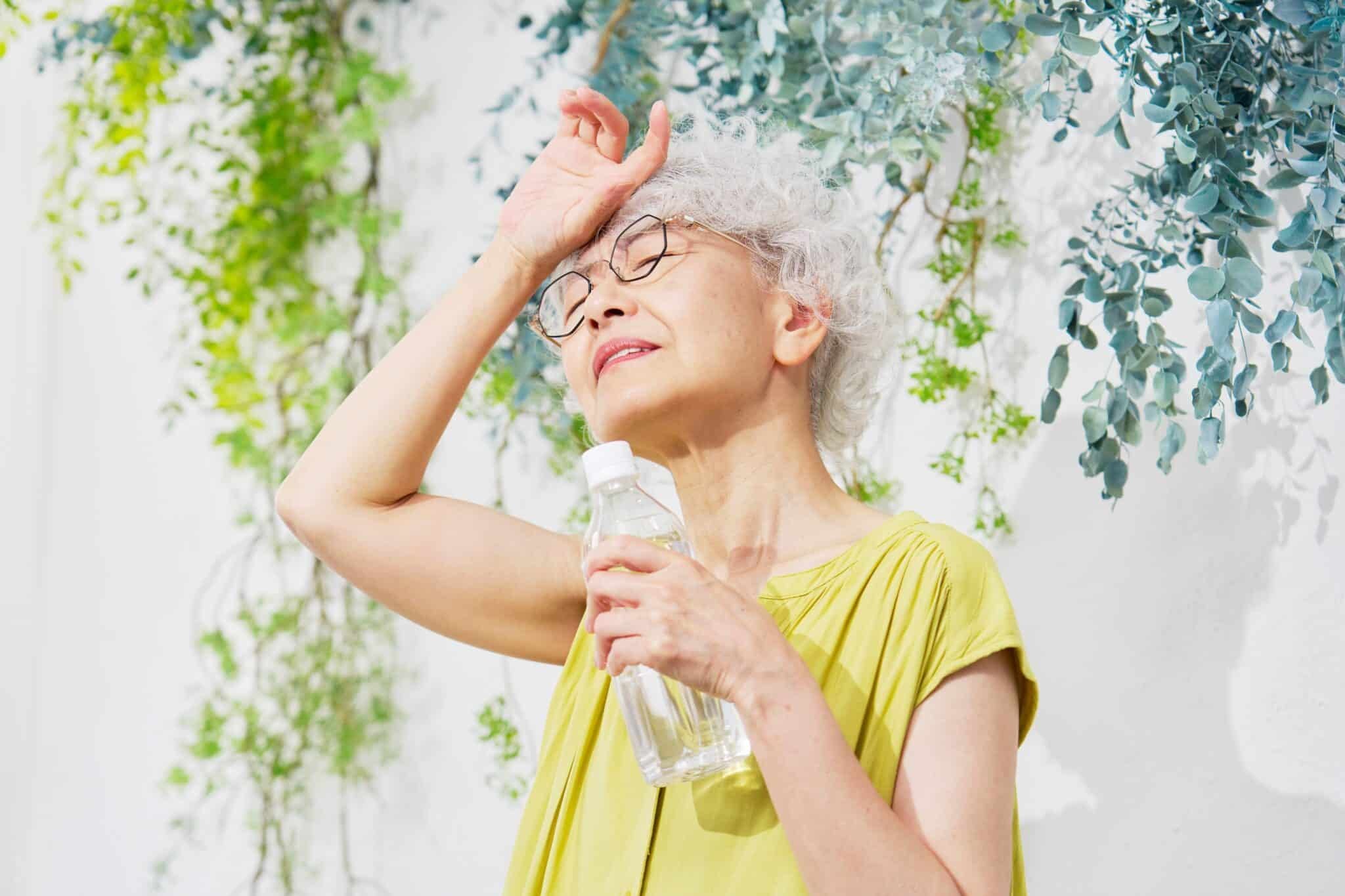 senior woman drinking water
