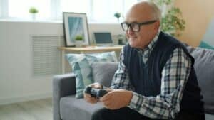 senior man playing video games