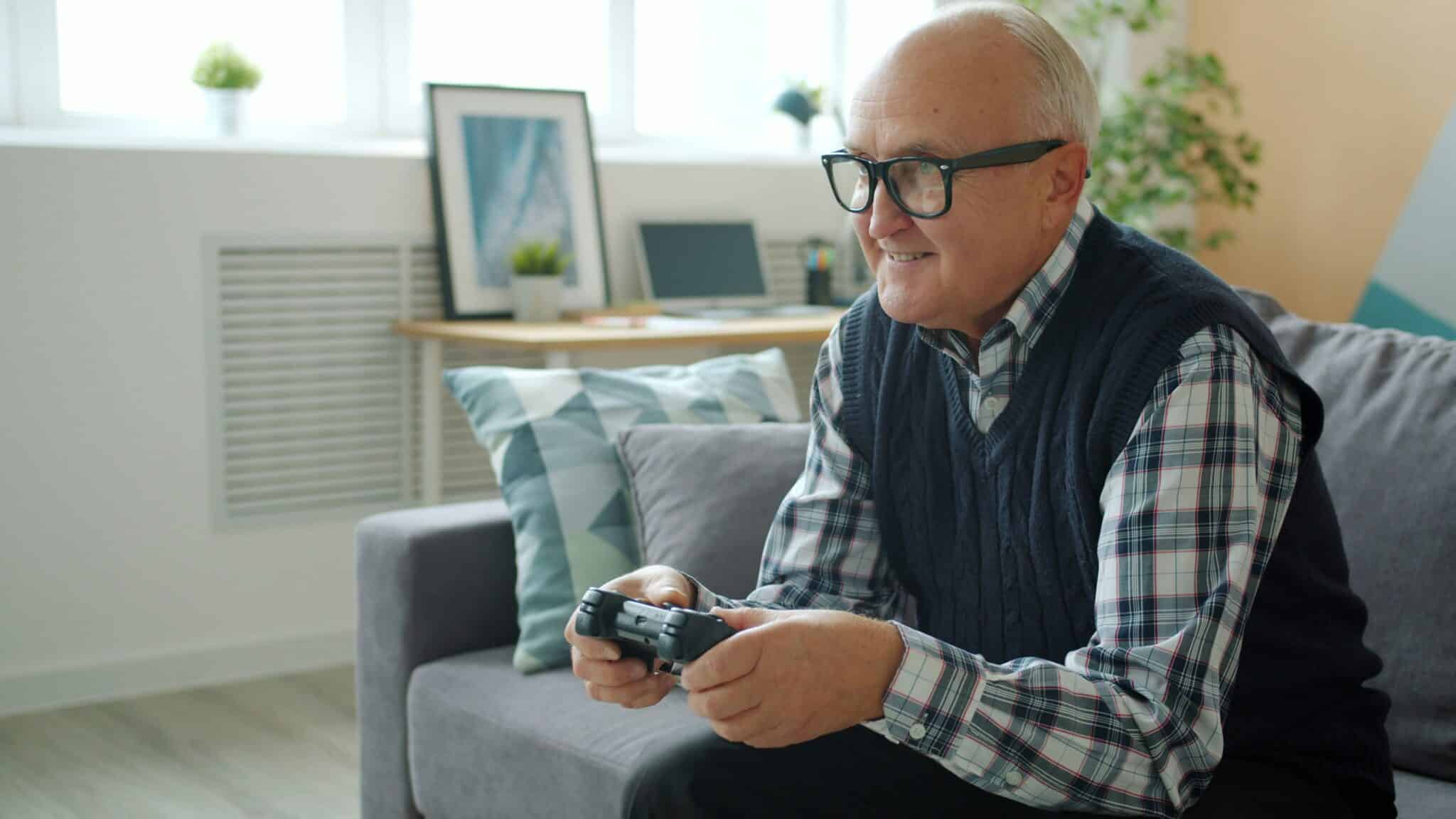 senior man playing video games